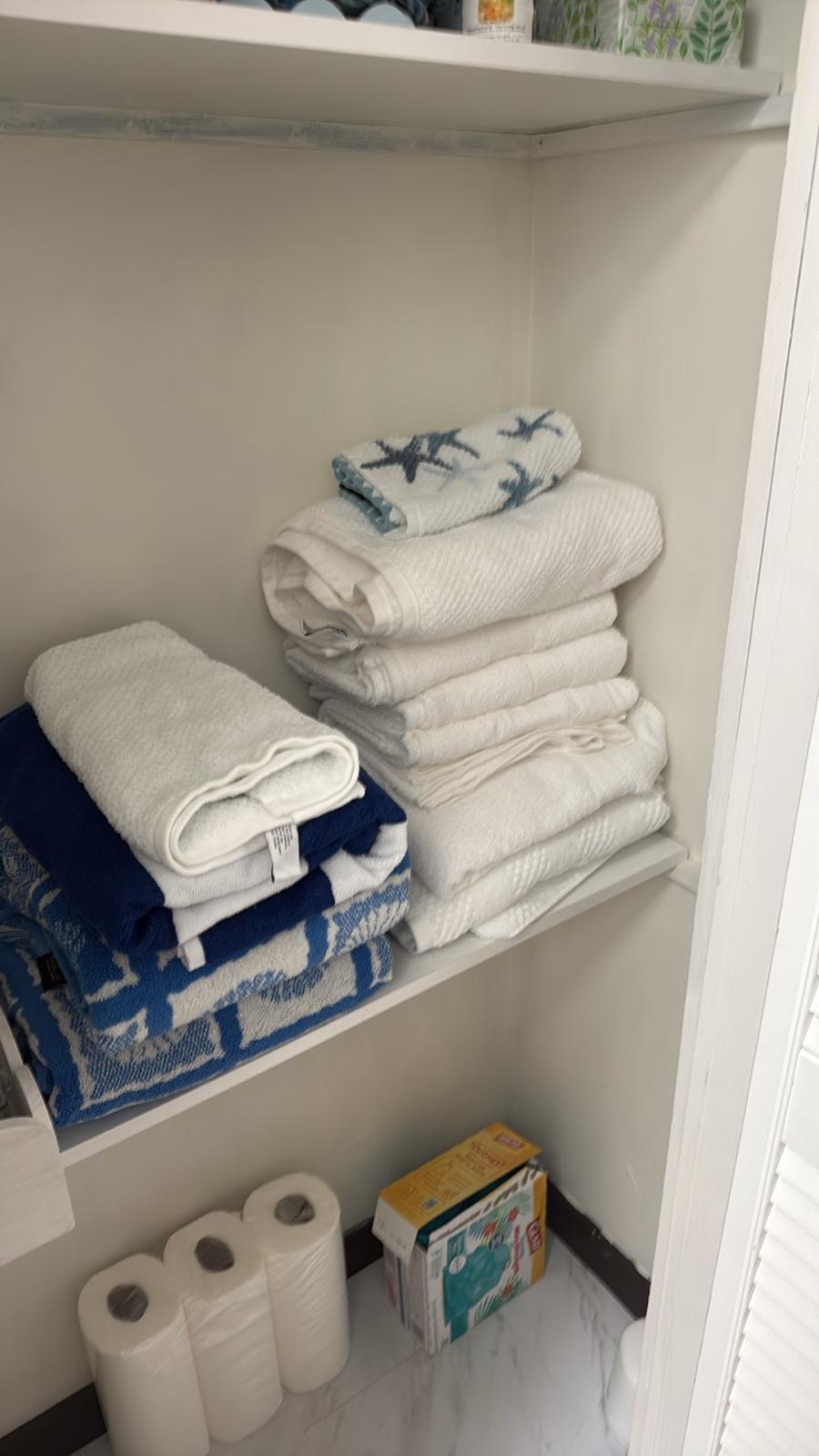 Linen closet organized by Tavares Cleaning