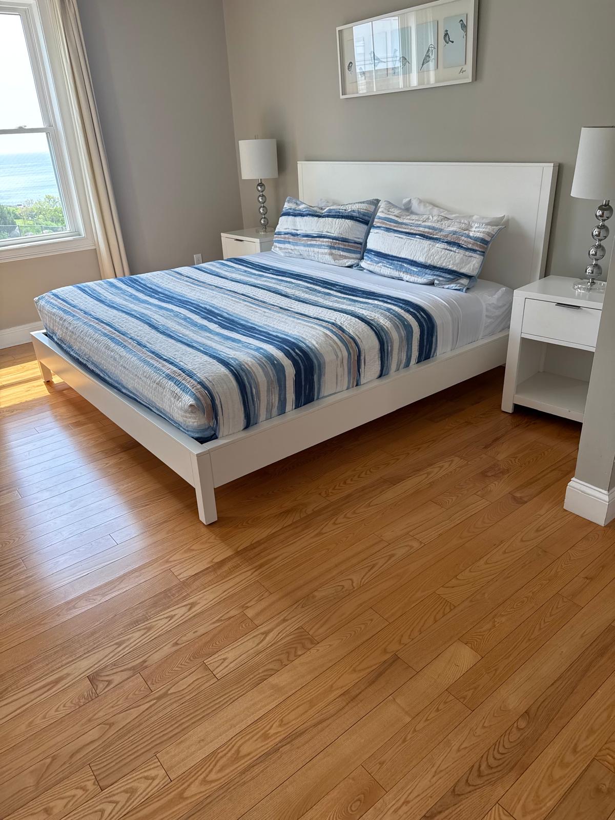 Ocean-view bedroom cleaned by Tavares Cleaning